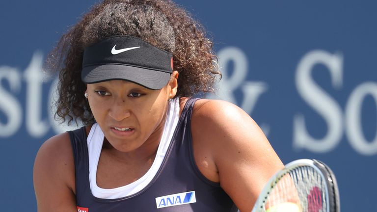 Naomi Osaka of Japan returns a shot against Anett Kontaveit of Estonia during the Western & Southern Open at the USTA Billie Jean King National Tennis Center on August 26, 2020 in New York City.