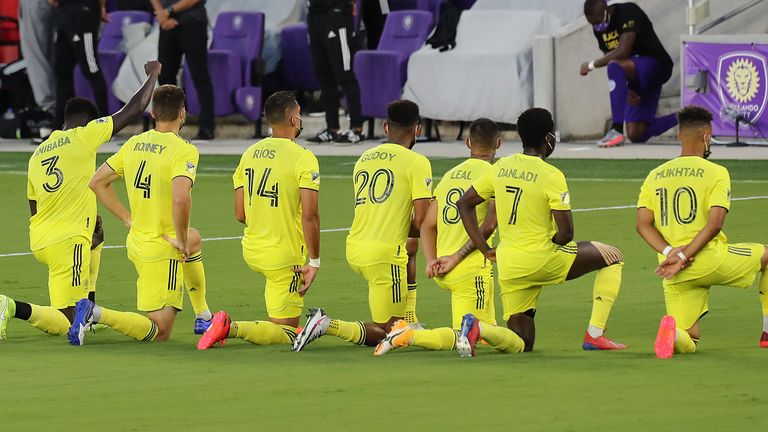 Nashville players take a knee in solidarity before their game against Orlando City which did take place
