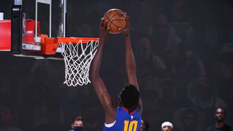 Bol Bol #10 of the Denver Nuggets dunks the ball against the LA Clippers on August 12, 2020 at the AdventHealth Arena at in Orlando, Florida.