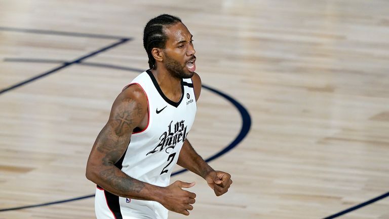 Kawhi Leonard #2 of the Los Angeles Clippers reacts after making a three-point shot against the Dallas Mavericks during the second half of an NBA basketball game at the ESPN Wide World Of Sports Complex on August 6, 2020 in Lake Buena Vista, Florida. 