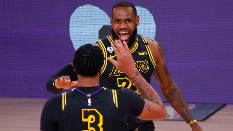 LeBron James and Anthony Davis celebrate for the LA Lakers