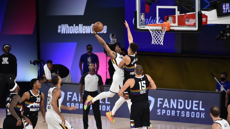Donovan Mitchell #45 of the Utah Jazz dunks the ball against the Denver Nuggets during Round One, Game Five of the NBA Playoffs on August 25, 2020 at The Field House in Orlando, Florida.