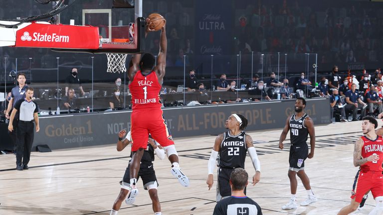 Zion Williamson #1 of the New Orleans Pelicans catches an alley-pop pass against the Sacramento Kings on August 6, 2020 at The Arena at ESPN Wide World of Sports in Orlando, Florida. 