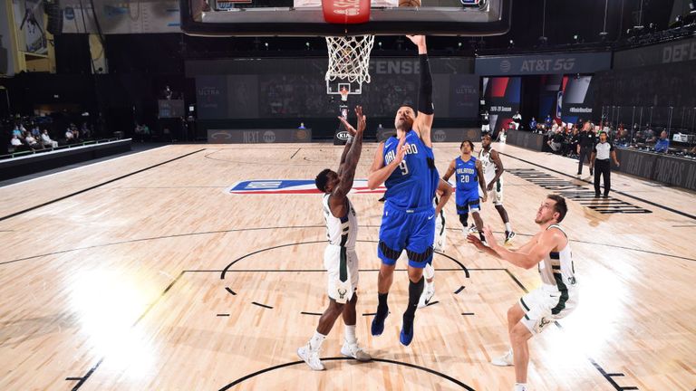 Nikola Vucevic #9 of the Orlando Magic shoots the ball during the game against the Milwaukee Bucks during Round One, Game One of the NBA Playoffs on August 18, 2020 at The Field House at ESPN Wide World Of Sports Complex in Orlando, Florida