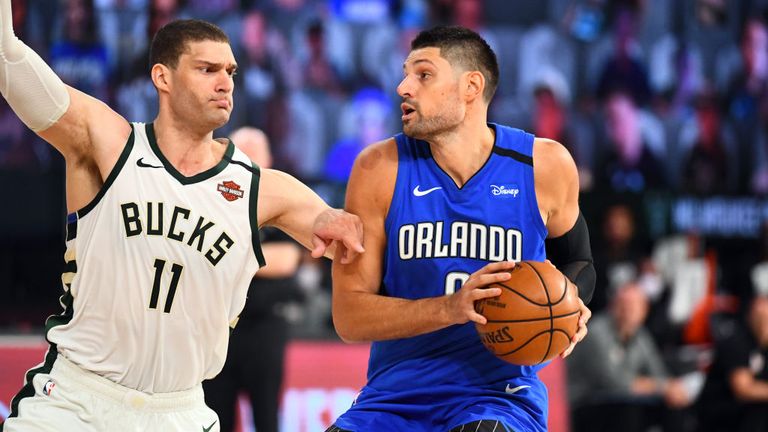 Nikola Vucevic #9 of the Orlando Magic handles the ball during the game against the Milwaukee Bucks during Round One, Game One of the NBA Playoffs on August 18, 2020 at The Field House at ESPN Wide World Of Sports Complex in Orlando,