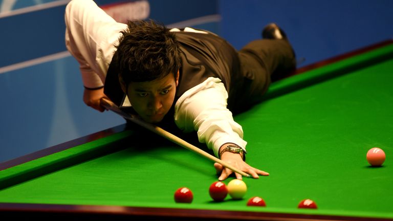 Noppon Saengkham plays a shot against Neil Robertson during their first round match of the World Snooker Championship at Crucible Theatre on April 19, 2017 in Sheffield, England.