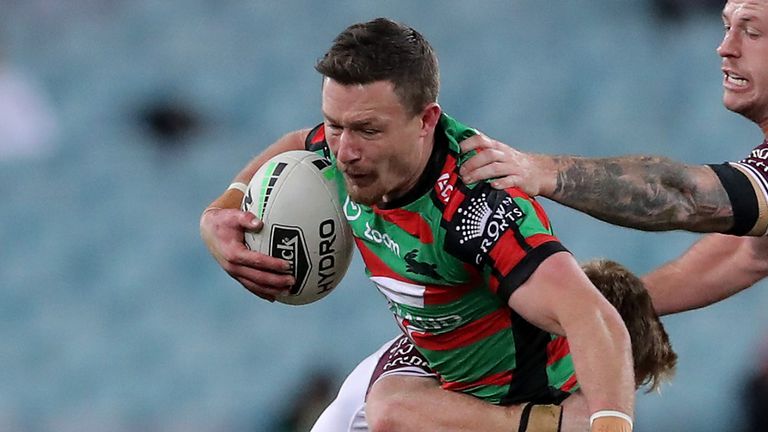 SYDNEY, AUSTRALIA - AUGUST 22: Damien Cook of the Rabbitohs is tackled during the round 15 NRL match between the South Sydney Rabbitohs and the Manly Sea Eagles at ANZ Stadium on August 22, 2020 in Sydney, Australia. (Photo by Matt King/Getty Images)