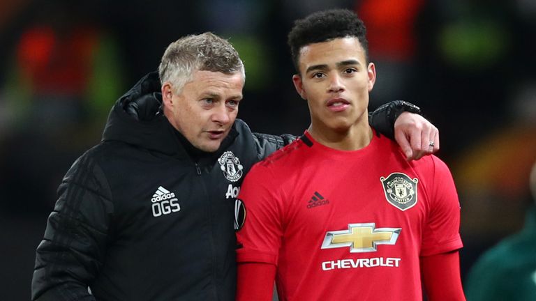 Ole Gunnar Solskjaer speaks to Mason Greenwood following Manchester United's win over Club Brugge in the UEFA Europa League round of 32 second leg