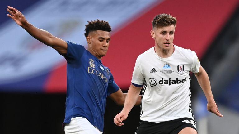 Ollie Watkins challenges Tom Cairney during the Championship play-off final