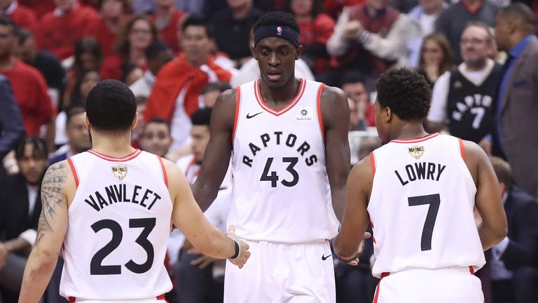 Pascal Siakam is congratulated by Kyle Lowry and Fred VanVleet