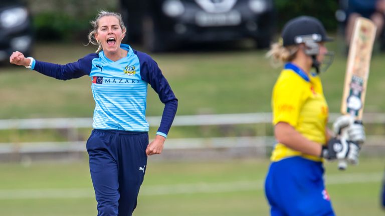 Celebrating taking a wicket in Yorkshire colours