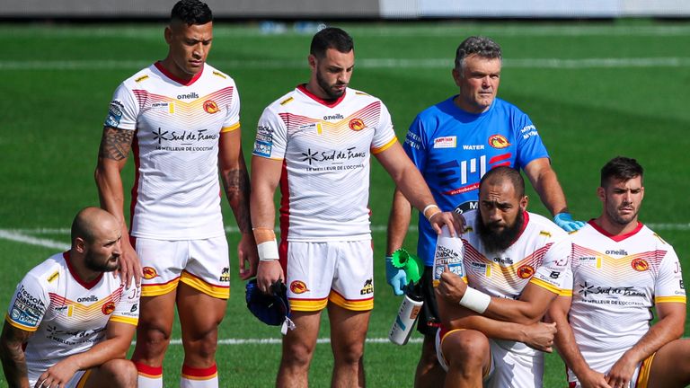 Folau (second left) and Benjamin Jullien (third left) stand up as their team-mates take a knee in support of the Black Lives Matter movement