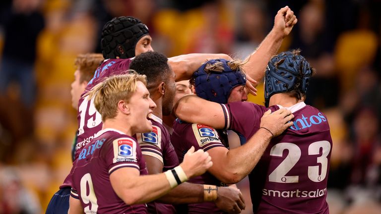 BRISBANE, AUSTRALIA - AUGUST 15: Queensland Reds players celebrate a Jock Campbell try during the round seven Super Rugby AU match between the Queensland Reds and the Melbourne Rebels at Suncorp Stadium on August 15, 2020 in Brisbane, Australia. (Photo by Albert Perez/Getty Images)