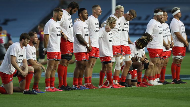  Sale Sharks team line up wearing 'Rugby Against Racism' t-shirts for the Gallagher Premiership Rugby match between Harlequins and Sale Sharks at Twickenham Stoop on August 14, 2020 in London, England.