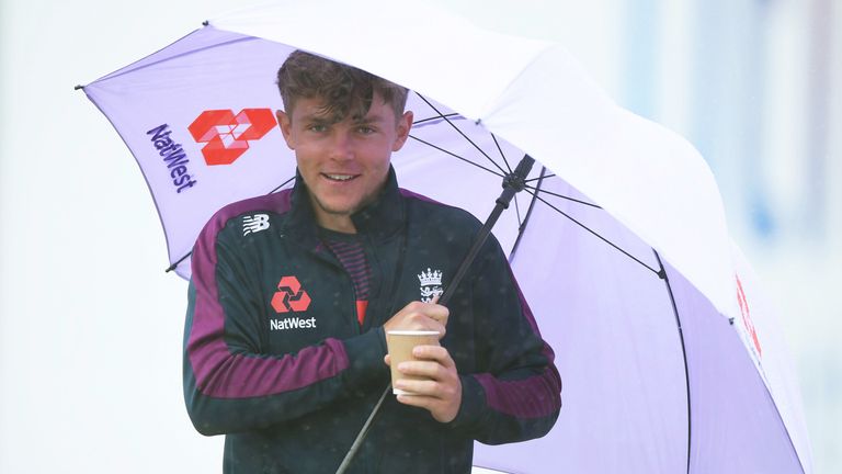 SOUTHAMPTON, ENGLAND - AUGUST 19: Sam Curran of England makes his way through the heavy rain towards the indoor net area during an England Net Session at Ageas Bowl on August 19, 2020 in Southampton, England. (Photo by Stu Forster/Getty Images for ECB)