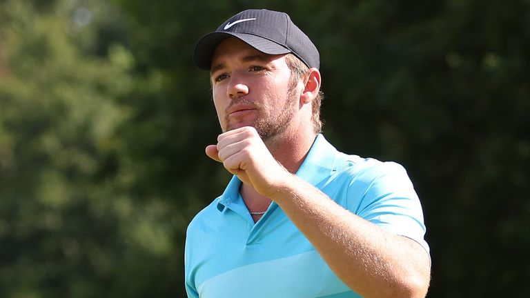 Sam Horsfield celebrates after holing the winning putt at the Hero Open