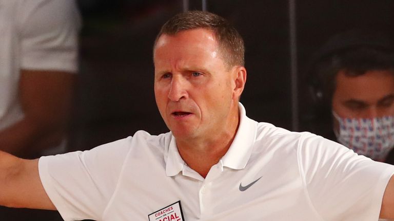 Scott Brooks issues instructions to his Wizards players from the sideline