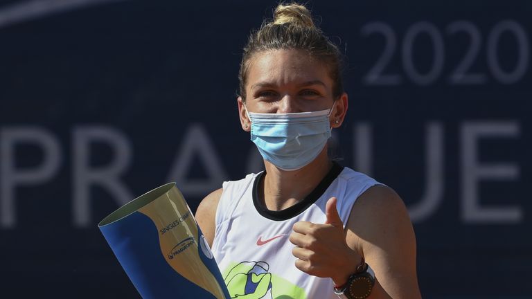 Simona Halep of Romania celebrates with the trophy after winning the Women's Singles Final against Elise Mertens of Belgium during the WTA Prague Open tennis tournament at TK Sparta Praha on August 16, 2020 in Prague, Czech Republic