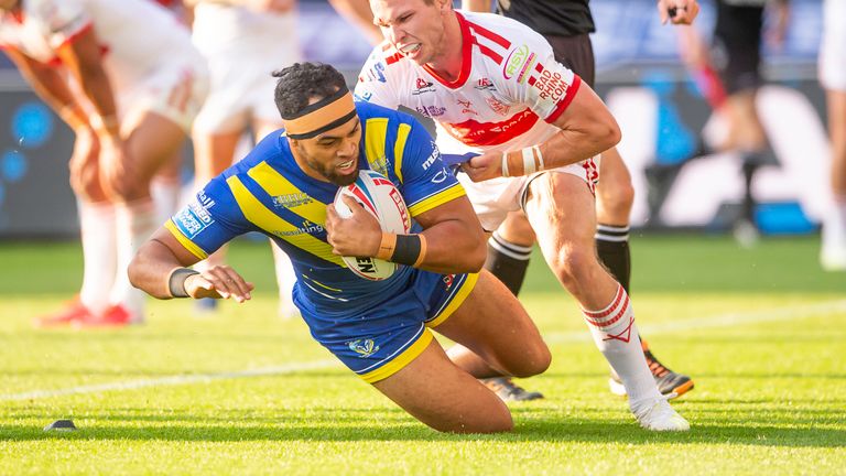 Warrington's Sitaleki Akauola scores for the wolves