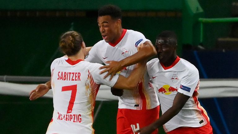 RB Leipzig's Tyler Adams celebrates with team-mates after scoring against Atletico Madrid