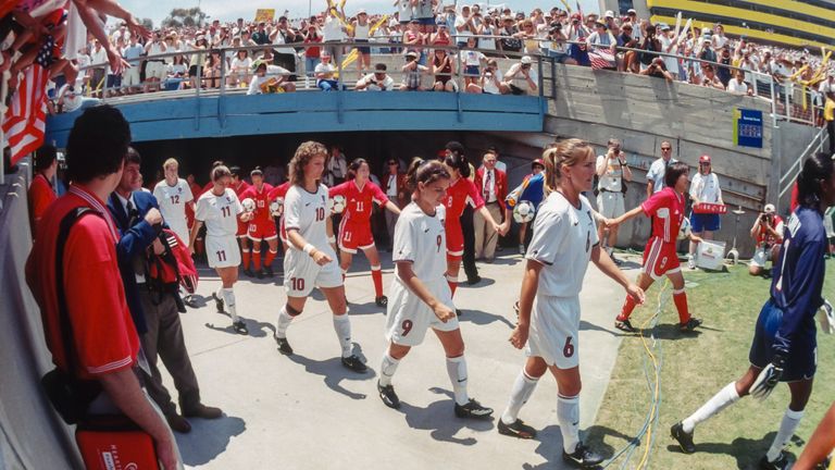 PASADENA, CA -  JULY 10:  Members of the USA and China national teams enter the field prior to the final game of the 1999 FIFA Women's World Cup played on July 10, 1999 at the Rose Bowl in Pasadena, California.  Visible USA players include Cindy Parlow #12, Julie Foudy #11, Michelle Akers #10, Mia Hamm #9, Brandi Chastain #6, and Brianna Scurry #1.  (Photo by David Madison/Getty Images) *** Local Caption *** Michelle Akers;Mia Hamm;Brandi Chastain