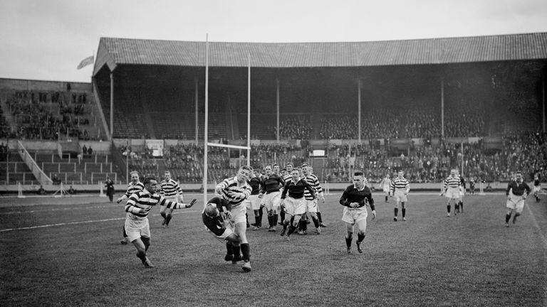 A Wigan player (in light top, centre, left) tackles an opponent during the first Challenge Cup Final, between Wigan and Dewsbury, at Wembley Stadium, London, 4th May 1929. Wigan won the match 13-2. (Photo by Puttnam/Topical Press AgencyHulton Archive/Getty Images)