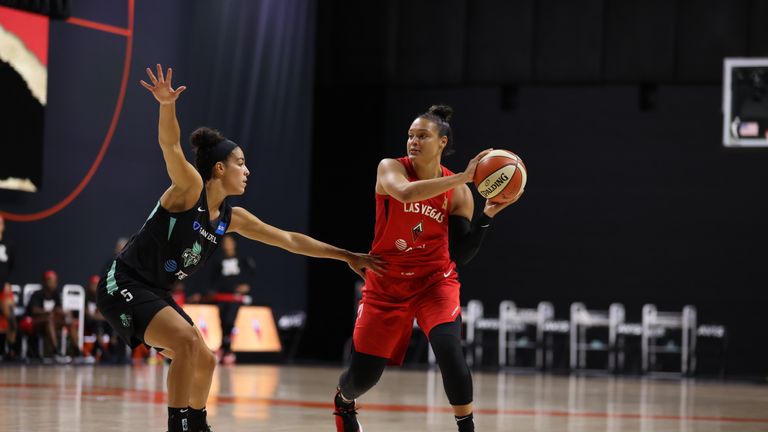Liz Cambage #8 of the Las Vegas Aces looks to pass against Kia Nurse #5 of the New York Liberty during a game on August 9, 2020 at Feld Entertainment Center in Palmetto, Florida.