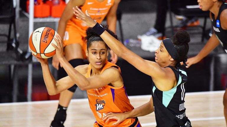 Skylar Diggins-Smith #4 of the Phoenix Mercury looks to pass the ball around Leaonna Odom #0 of the New York Liberty during the first half of a game at Feld Entertainment Center on August 02, 2020 in Palmetto, Florida. 