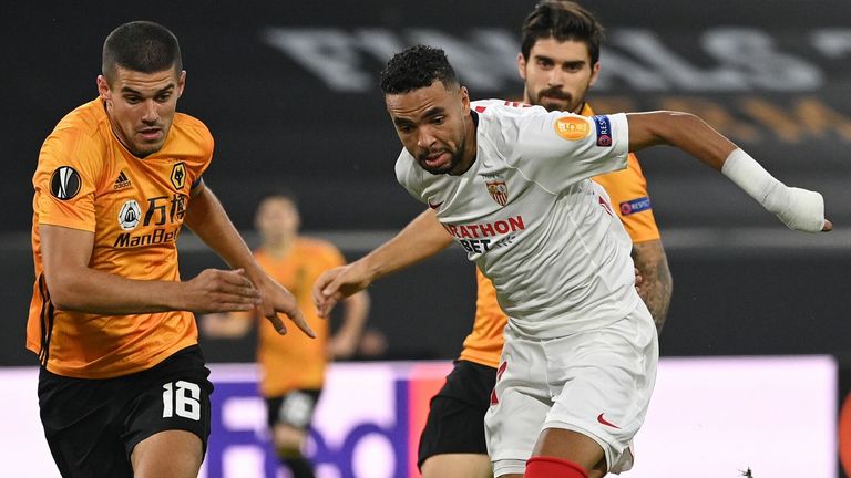 Sevilla's forward Youssef En-Nesyri (R) vies with Wolves defender Conor Coady 