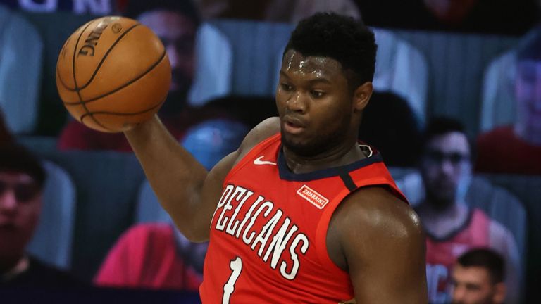 Zion Williamson leaps to grab a rebound in the Pelicans' win over the Grizzlies