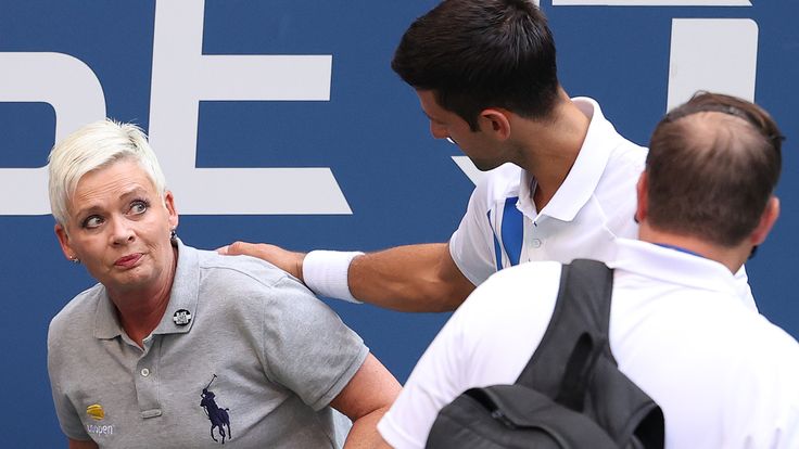Novak Djokovic consoles the lineswoman after the incident
