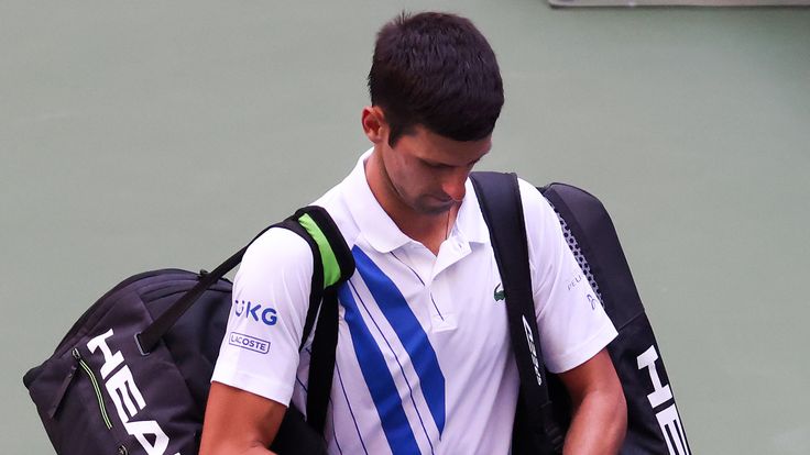 Novak Djokovic leaves the court after being defaulted from US Open for striking ball at line judge
