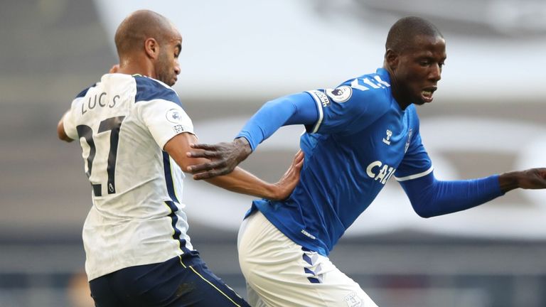 Abdoulaye Doucoure is closed down by Lucas Moura during the first half