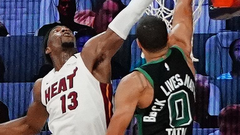 Bam Adebayo #13 of the Miami Heat blocks a dunk attempt in the game against Jayson Tatum #0 of the Boston Celtics during Game One of the Eastern Conference Finals of the NBA Playoffs