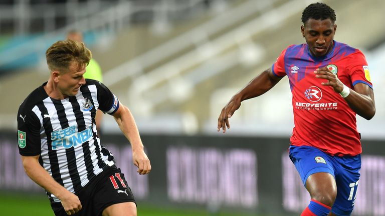 Matt Ritchie takes on Amari'i Bell at St James' Park