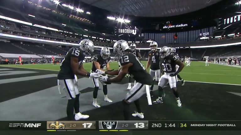 Zay Jones celebrated his touchdown for Las Vegas against New Orleans by pretending to apply hand sanitiser to his Raiders teammates.