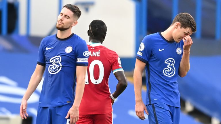 Andreas Christensen reacts to his red card following a VAR review