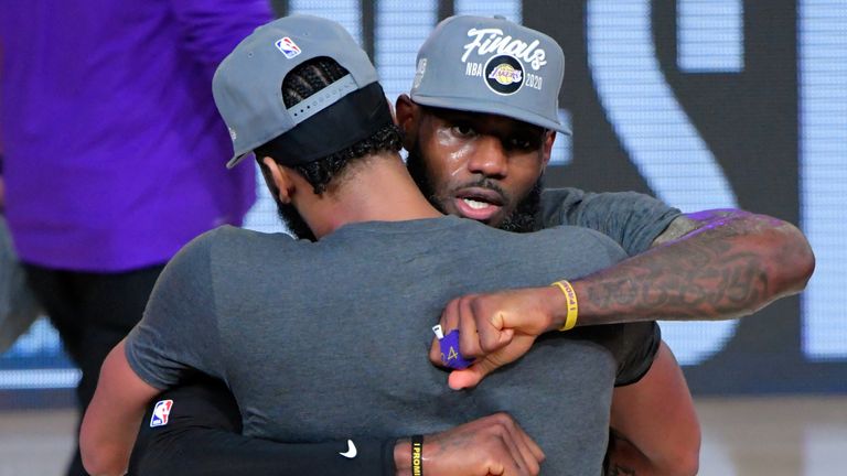 Anthony Davis hugs LeBron James at the conclusion of the Western Conference Finals