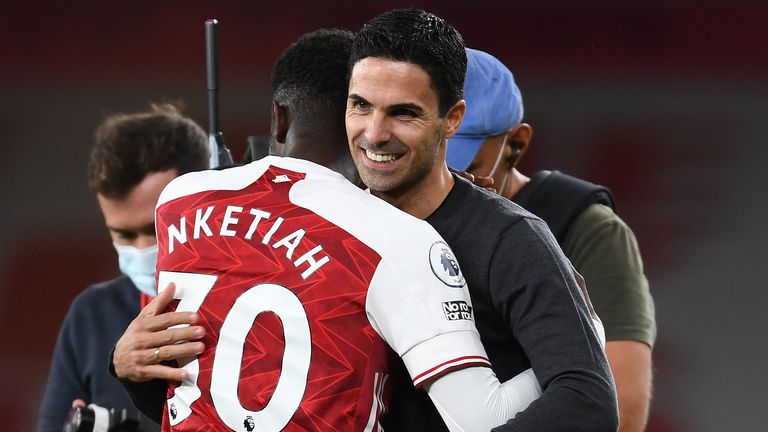 Mikel Arteta celebrates with Eddie Nketiah