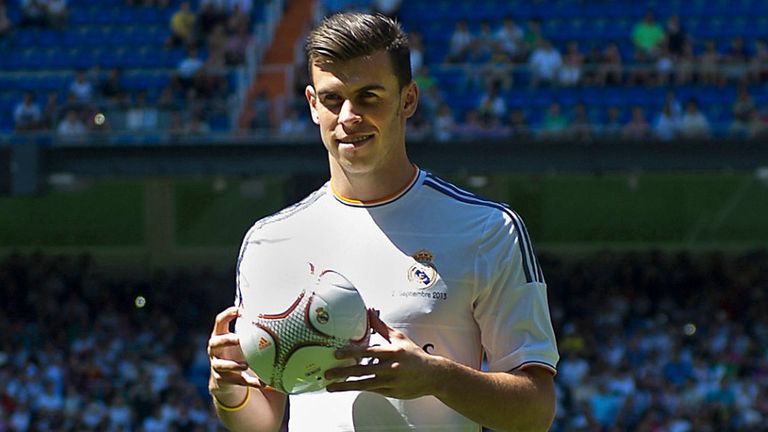 MADRID, SPAIN - SEPTEMBER 02:  Gareth Bale poses for photographs in his new Real Madrid shirt during his official unveiling at estadio Santiago Bernabeu on September 2, 2013 in Madrid, Spain.  (Photo by Denis Doyle/Getty Images)