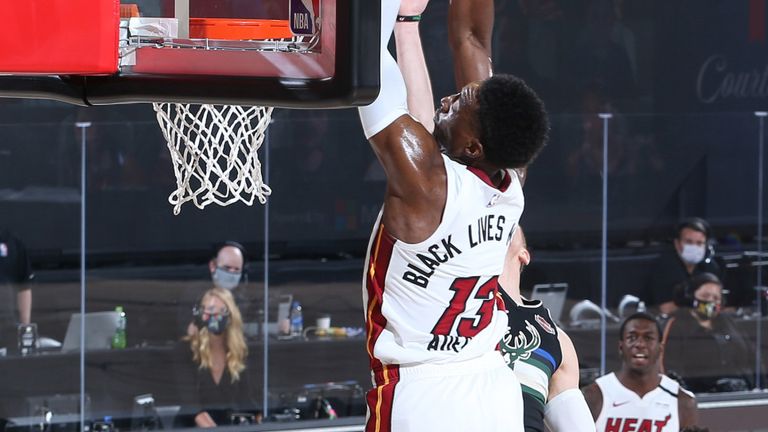 Bam Adebayo soars for an alley-oop slam in Miami's Game 2 win against the Bucks