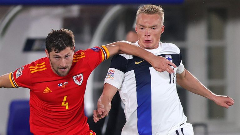 Ben Davies and Ilmari Niskanen battle for the ball during Finland vs Wales in the Nations League