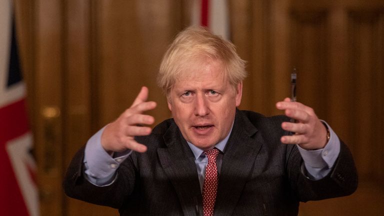 Prime Minister Boris Johnson gestures as he addresses the nation during a remote press conference at Downing Street on September 30, 2020 in London, England. 