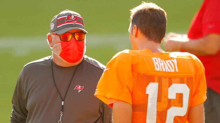 Head coach Bruce Arians of the Tampa Bay Buccaneers talks with Tom Brady during training camp