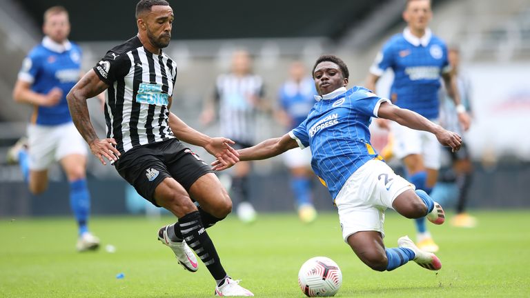 Callum Wilson of Newcastle United is tackled by Brighton's Tariq Lamptey