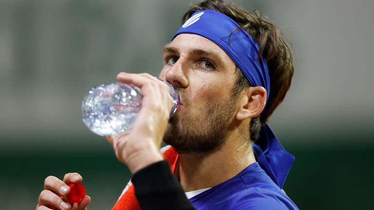 Cameron Norrie of Great Britain takes a drink during his Men's Singles first round match against Daniel Elahi Galan of Colombia on day two of the 2020 French Open at Roland Garros on September 28, 2020 in Paris, France