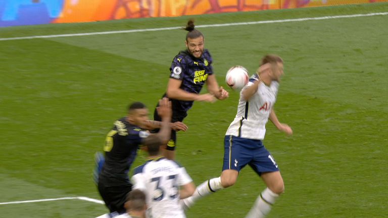 Andy Carroll heads the ball against Eric Dier as Newcastle are awarded a penalty against Tottenham