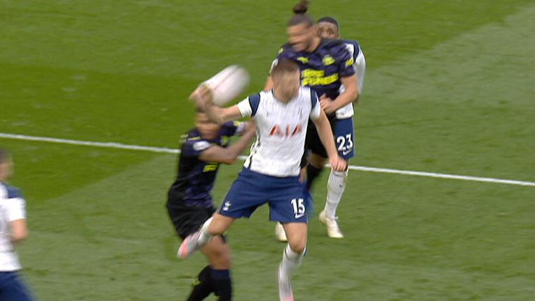 Andy Carroll heads the ball against Eric Dier as Newcastle are awarded a penalty against Tottenham