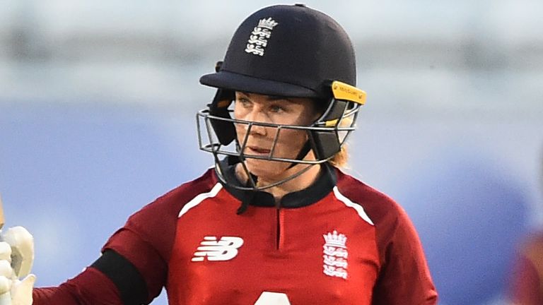 England's Tammy Beaumont raises her bat after reaching 50 in the first T20 against West Indies