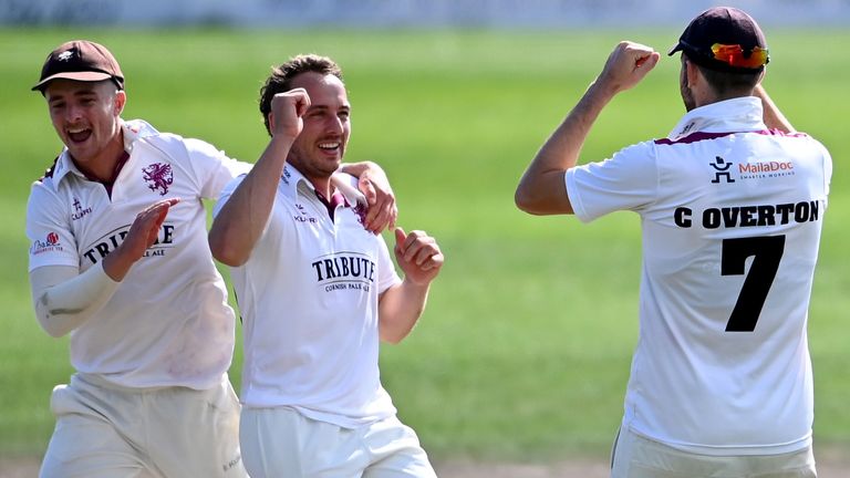 Somerset's Josh Davey (l) celebrates a wicket with Craig Overton
